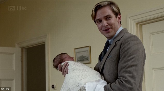 A photo of Matthew Crawley holding his newborn baby in Downton Abbey