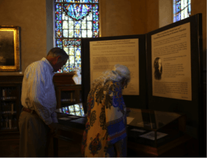A man and woman view a museum exhibit 