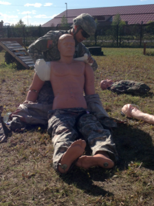 Cadet Hutchison helps set up the Expert Field Medic Badge course. 