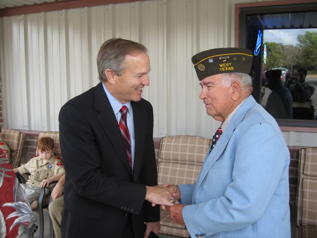 Former Representative Edwards shakes hands with a West, Texas veteran at the dedication of West's VFW post.