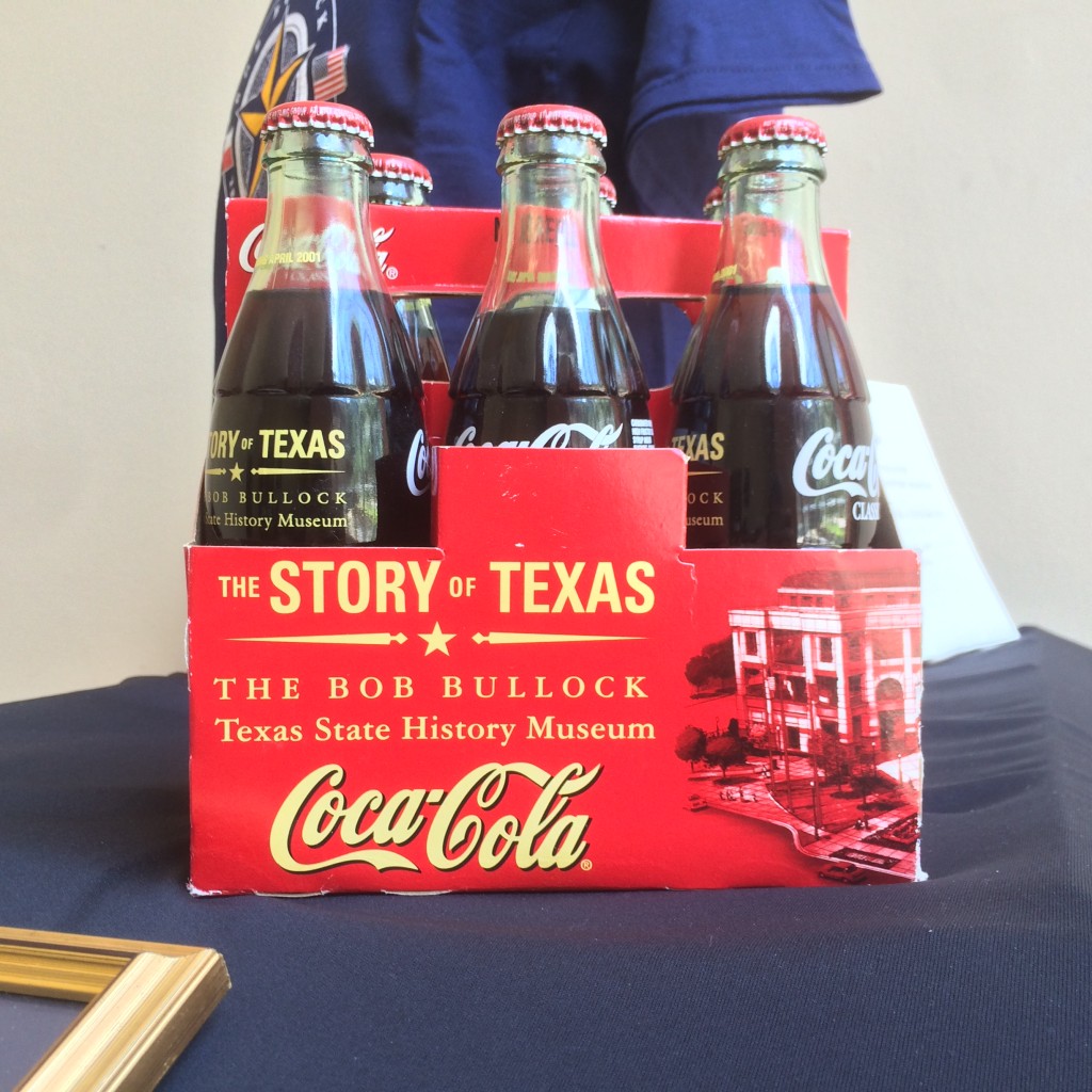 A commemorative six-pack of Coca-Cola printed with the museum's logo, name, and mission.