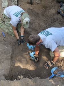 Stevie Hope, a 2014 Baylor anthropology graduate, and Cole Lindeberg, a senior anthropology major, work to exhume an unmarked grave at a cemetery in South Texas.