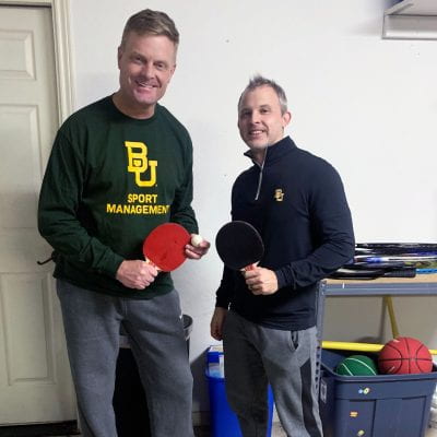 Dr. Bill Sterrett (left) and Dr. Mar Magnusen holding table tennis equipment