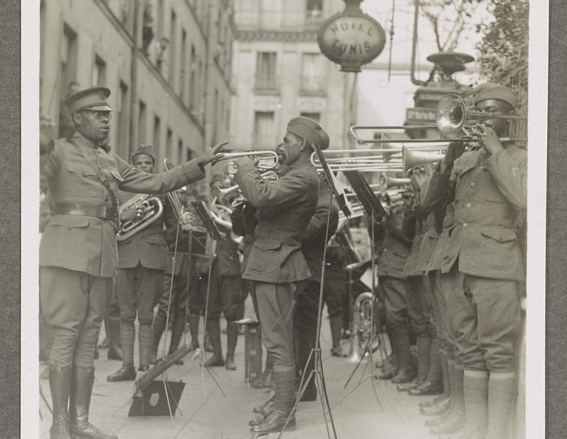 Black and white photo showing musicians of the 369th Infantry Regiment Band in performance, led by Europe.